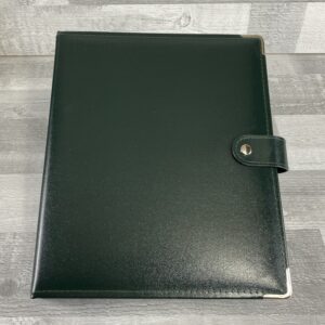 recycled leather ring binder in colour green. fitted with a strap closure and round corners